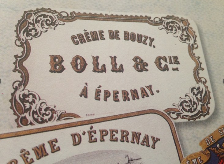 An original 19th-century label reading Crème de Bouzy, Boll & Cie à Épernay, with gilded ornamental borders